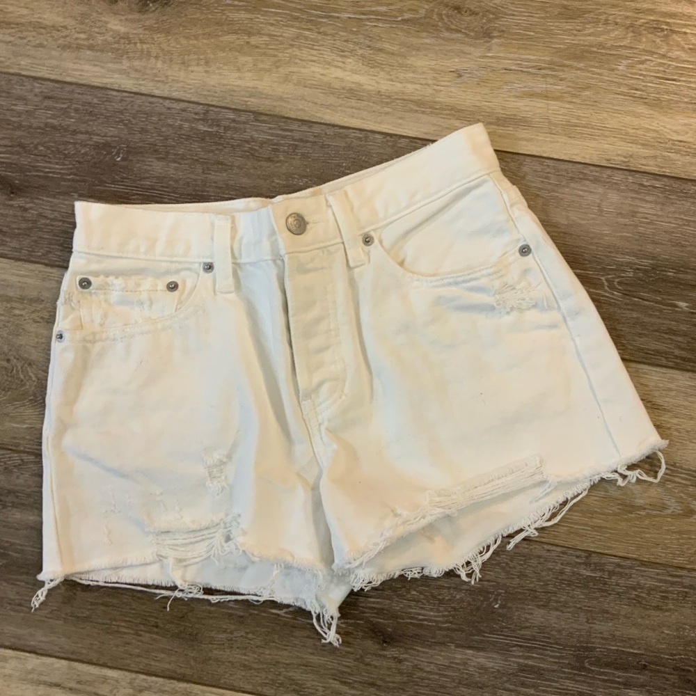 We the Free white distressed 5 button fly jean shorts. Size 26.